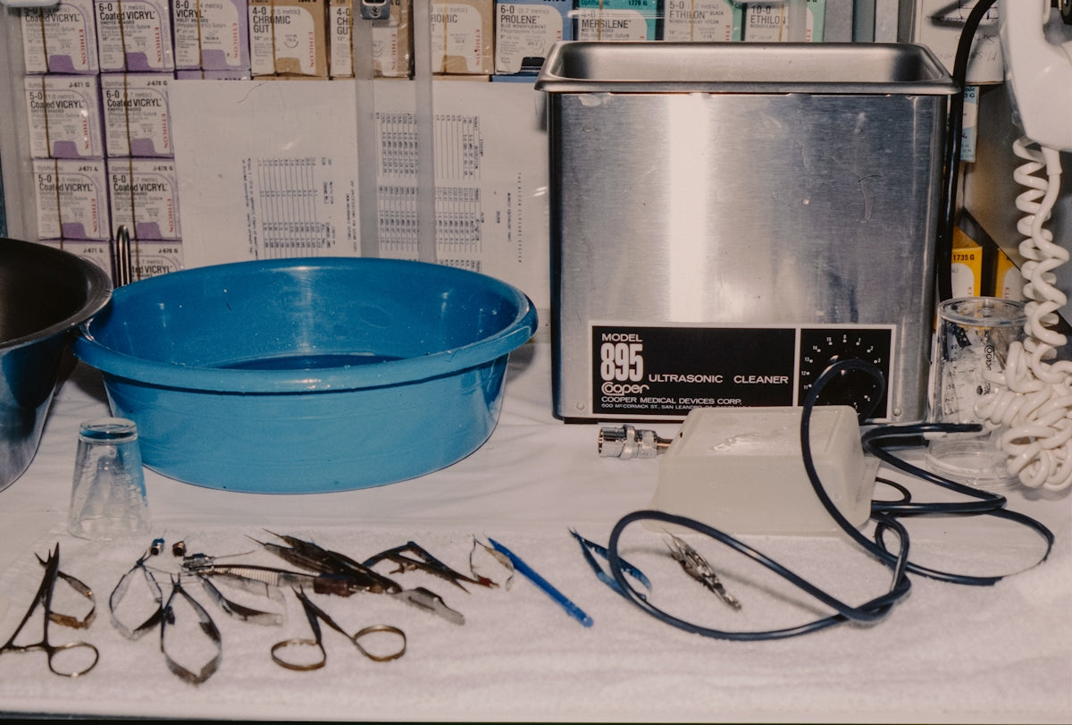 Surgical instruments and cleaning equipment on a table.